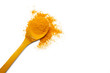 © gexphos - Dry turmeric powder and wooden spoon on  isolated white background.Close-up of powder orange color turmeric.top view and copy space