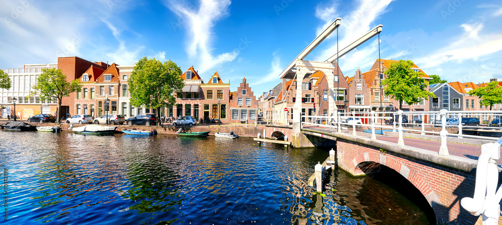 Historic old town of Alkmaar, North Holland, with typical canal houses and draw bridge - obrazy, fototapety, plakaty 