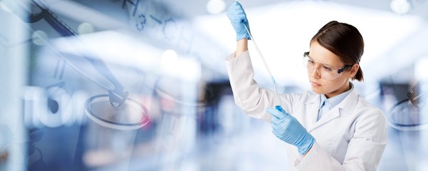 Wall Mural - Young female scientist standing  on background