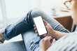 © panitan - Mockup image blank white screen cell phone.man hand holding texting using mobile.background empty space for advertise text.people contact marketing business,technology