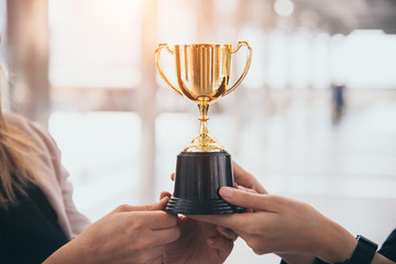 champion golden trophy for winner background. success and achievement concept. sport and cup award t