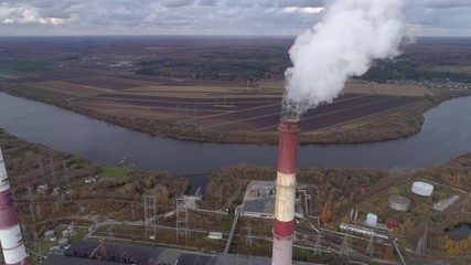 Wall Mural - State District Power Station aerial view. Steam comes from a high factory chimney.