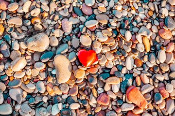 Poster - Romantic symbol of red heart on the pebble beach