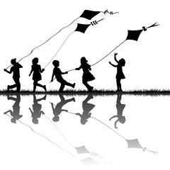 Wall Mural - Children silhouettes playing with kites flying outdoor