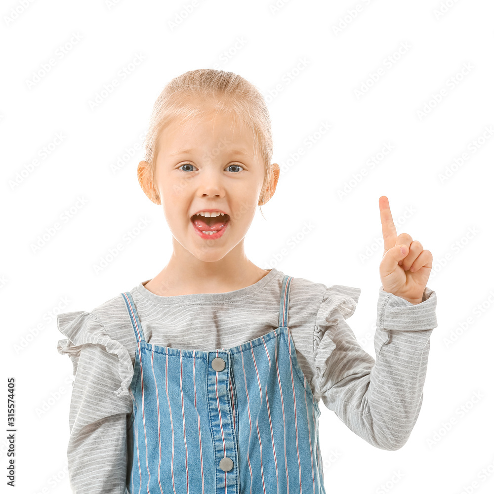Cute little girl with raised index finger on white background