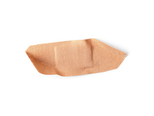 used sticking plaster isolated on white, top view. first aid item