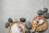Fototapeta Mapy - Flat lay composition with sea salt and spa stones on grey marble table. Space for text