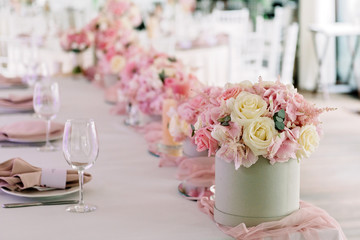 Table decor with flowers for a wedding party.