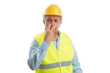 Wall Mural - Construction worker pointing fingers at eyes