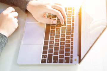 woman working at home office using laptop searching web, browsing information