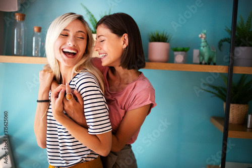 Cuadros en Lienzo Cheerful lesbians embrace passioantely and have fun together