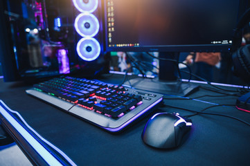 The abstract image of the gamer's desk consisting of the desktop computer and gaming gear. the concept of activities, gaming, technology, lifestyle, education, e-sport and internet of things.