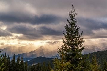 Canvas Print - Dramatic sunset high in the winter mountains.