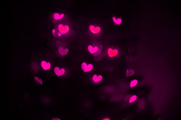Wall Mural - Pink hearts bokeh background. Valentine’s Day, symbol of love..