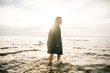 © Nikita - Woman portrait in  coat on sea beach