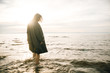 © Nikita - Woman portrait in  coat on sea beach