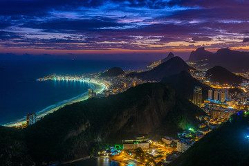 Fototapete - Sunset view of Copacabana,  Urca and Botafogo in Rio de Janeiro, Brazil. Skyline of Rio de Janeiro. Night cityscape of Rio de Janeiro