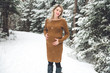 © Louis-Photo - Young happy pregnant woman in snowy forest