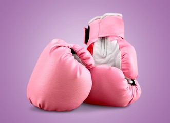 Wall Mural - Sports pink boxing gloves on pastel background