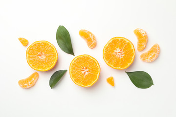 Sticker - Mandarins and leaves on white background, top view