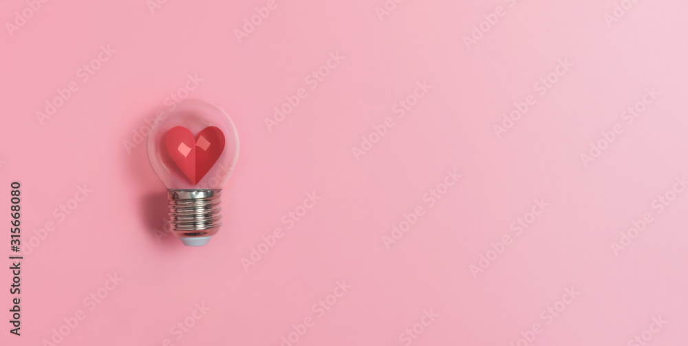 Red heart in light bulb on pink background with copy space. Valentine's day, Creative idea, Inspiration Concept. - obrazy, fototapety, plakaty 