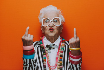 funny grandmother portraits. senior old woman dressing elegant for a special event. granny fashion m