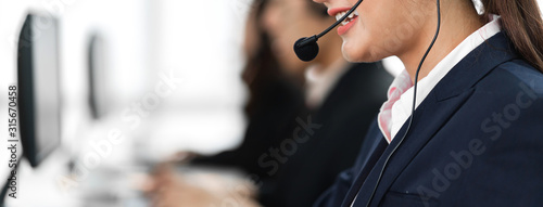 Fotografía Beautiful businesswoman customer support services working with headset and compu