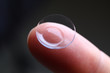 © megaflopp - Human finger holding soft contact lens