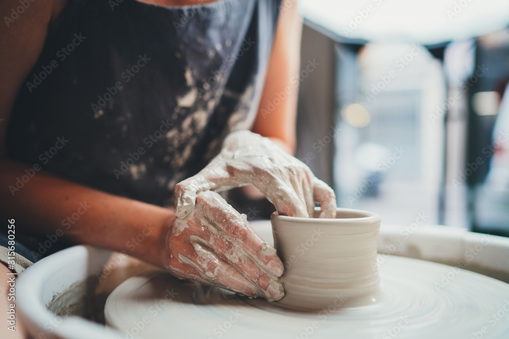 It's all about form! Closeup Image of Female Ceramic Artist Working With Pottery Wheel Makes Shape of Future Mug, Process in Pottery Workshop Creative People Handmade Products - obrazy, fototapety, plakaty 
