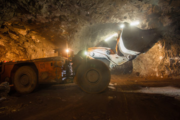 Canvas Print - Underground gold bauxite mine shaft tunnel with LHD machine scoop