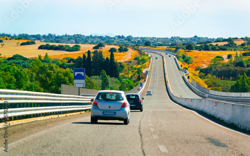 Fotomural Car on the road at Costa Smeralda in Sardinia Island in Italy summer