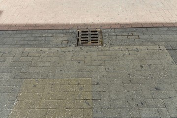  Close up view of outdoor sewer grate for water drainage isolated.