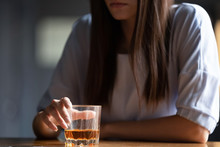 Close Up Of Woman Drinking Alcohol At Bar Counter