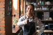 Smiling waitress in apron show thumbs up recommending place