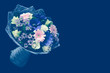 bouquet of flowers on an isolated classic blue background toned in blue tint