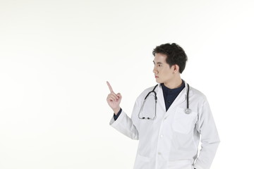 the young asian medical doctor and his stethoscope at isolated white background copy space 