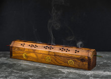 A Long Wooden Incense Burner Holder On A Grey Stone Tile Base With Black Background And Copy Space