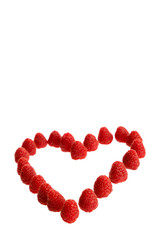 Wall Mural - Ripe raspberries lying in a heart shape isolated in white