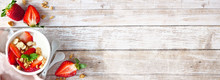 Healthy Yogurt With Fresh Strawberries And Granola. Banner With Corner Border Against A Rustic Wood Background. Copy Space.