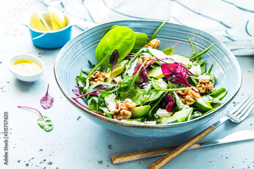 Fresh colorful spring salad - avocado, walnuts and feta cheese Poster Mural XXL