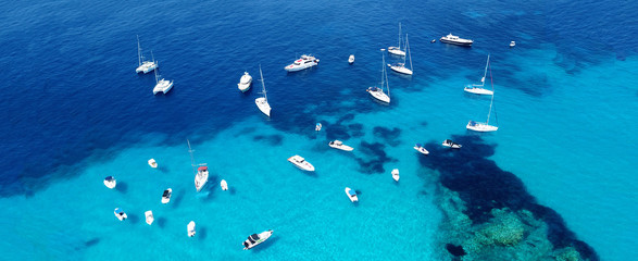 Wall Mural - Aerial drone ultra wide photo of sailing yacht docked in paradise turquoise sea exotic island destination