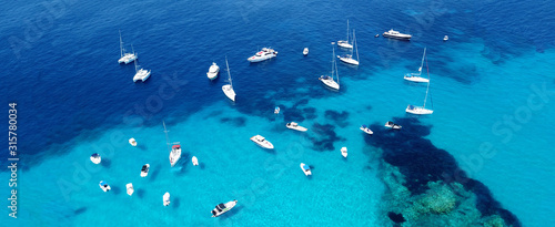 Aerial drone ultra wide photo of sailing yacht docked in paradise turquoise sea Canvas Print