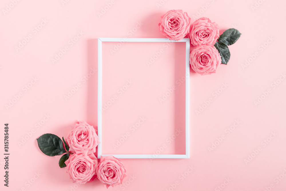 Beautiful flowers composition. Blank frame for text, pink rose flowers on pastel pink background. Valentines Day, Easter, Birthday, Happy Women's Day, Mother's day. Flat lay, top view, copy space - obrazy, fototapety, plakaty 