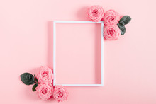 Beautiful Flowers Composition. Blank Frame For Text, Pink Rose Flowers On Pastel Pink Background. Valentines Day, Easter, Birthday, Happy Women's Day, Mother's Day. Flat Lay, Top View, Copy Space