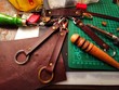 Close up working process of the leather key holder in the leather workshop.