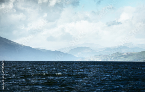 Fotomural Panoramic view of the rocky river shores from the water