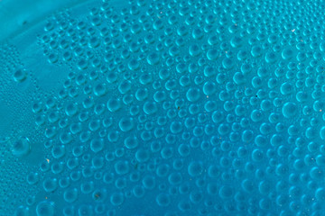 Wall Mural - Blue water drops background close up