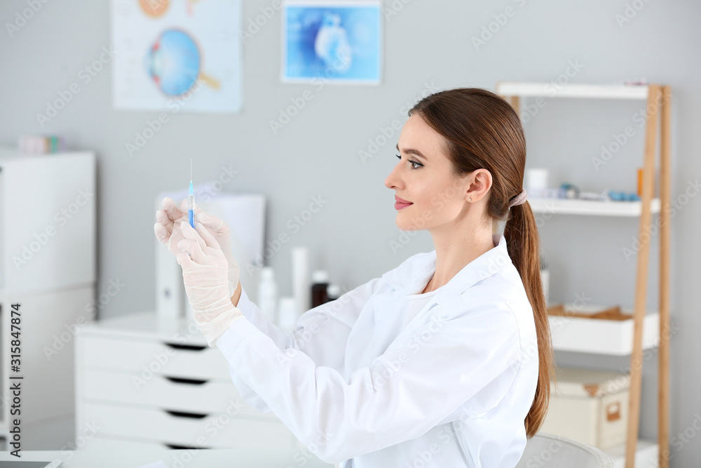 Doctor with syringe in clinic