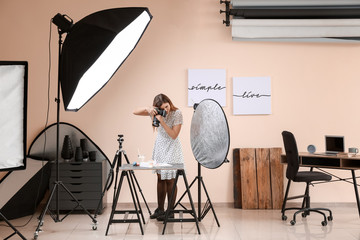 Poster - Young woman taking picture of macarons and milk in professional studio