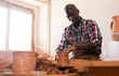 © JackF - Man making ceramics on pottery wheel